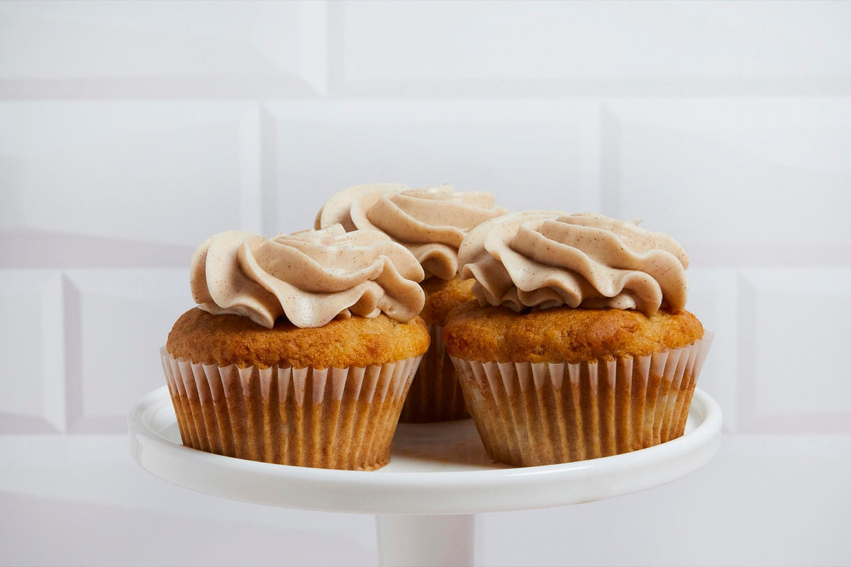 Apple cupcakes on a white cake stand